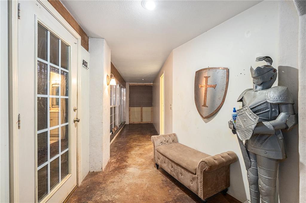 880 Golf Course Road Demorest, GA 30535 - Photo 14 of 37 a living room with furniture a rug a wall painting and a floor