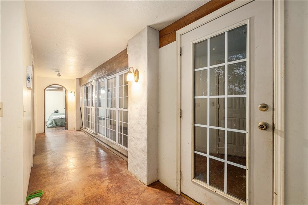 880 Golf Course Road Demorest, GA 30535 - Photo 15 of 37 a view of a hallway with wooden floor and windows