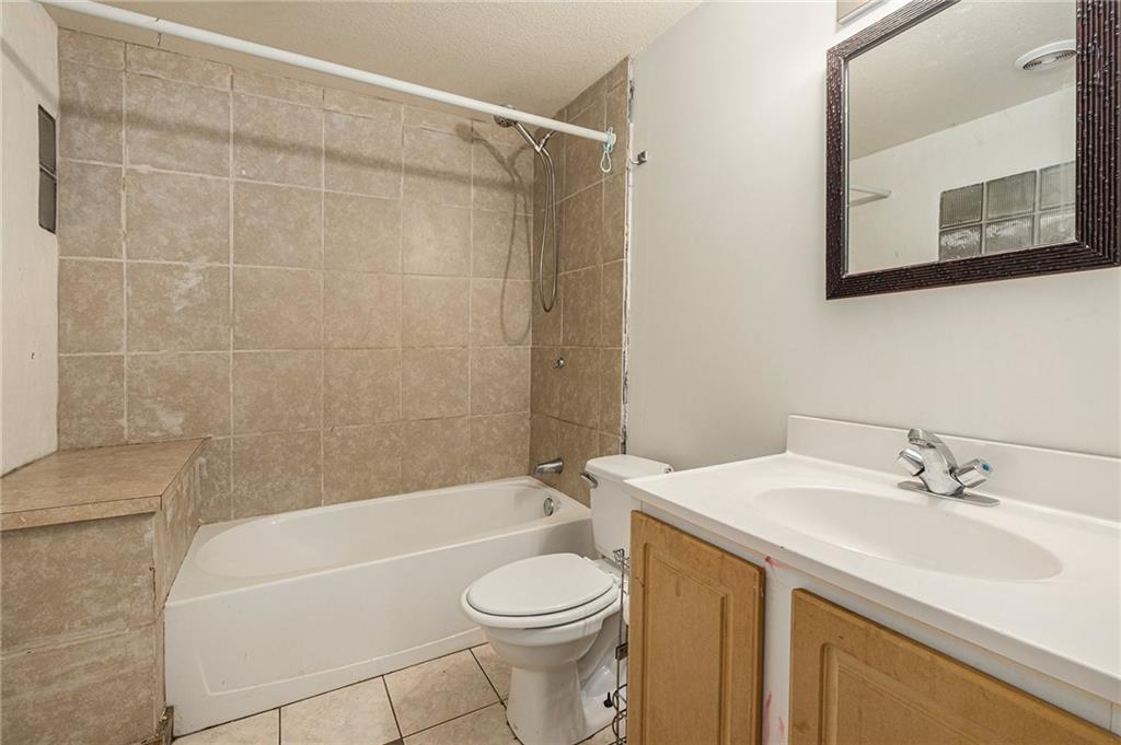 880 Golf Course Road Demorest, GA 30535 - Photo 19 of 37 a bathroom with a sink toilet and shower