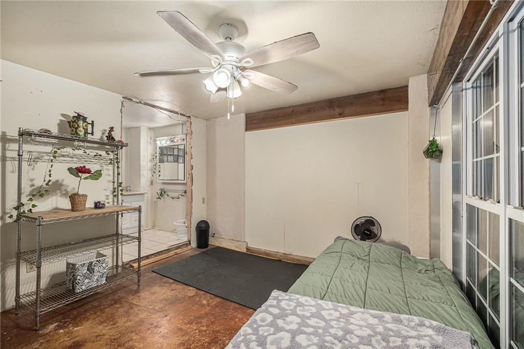 880 Golf Course Road Demorest, GA 30535 - Photo 20 of 37 a bedroom with a bed and a chandelier