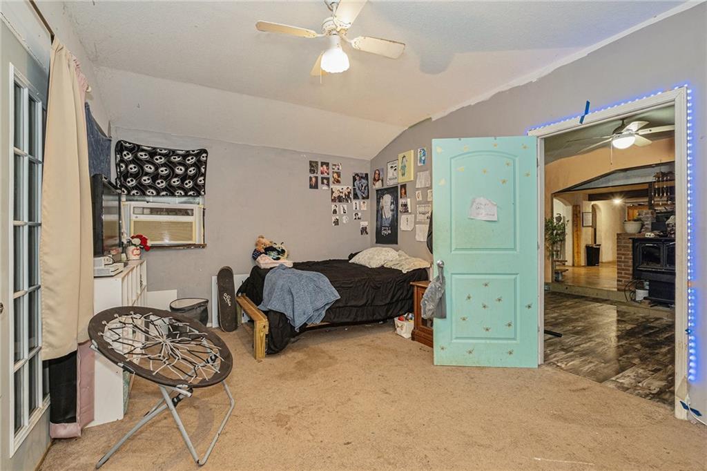 880 Golf Course Road Demorest, GA 30535 - Photo 22 of 37 a bedroom with furniture and a window