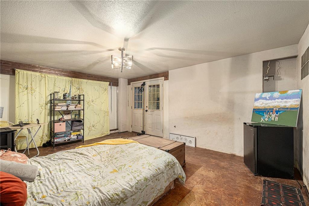 880 Golf Course Road Demorest, GA 30535 - Photo 25 of 37 a bedroom with a bed dresser and a window