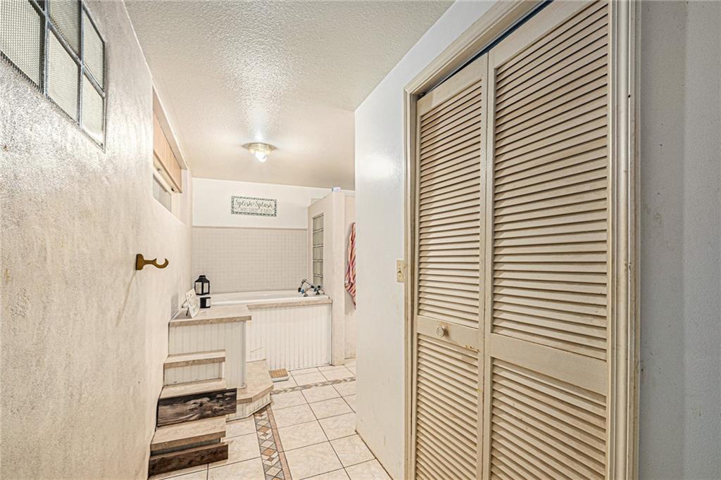 880 Golf Course Road Demorest, GA 30535 - Photo 27 of 37 a bathroom with a sink a mirror and a shower curtain