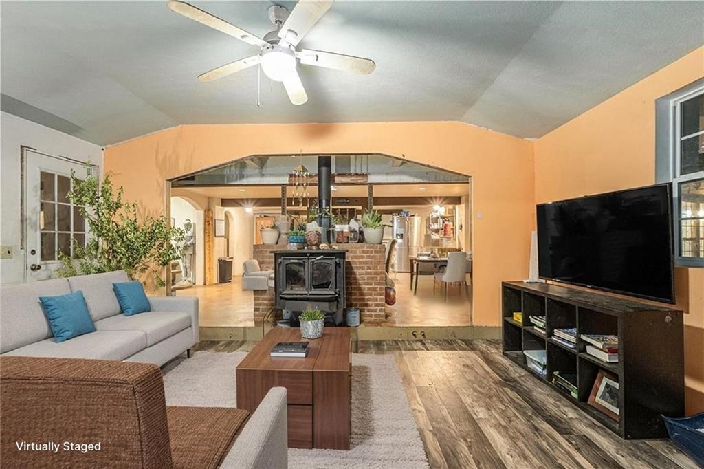 880 Golf Course Road Demorest, GA 30535 - Photo 3 of 37 a living room with furniture and a flat screen tv