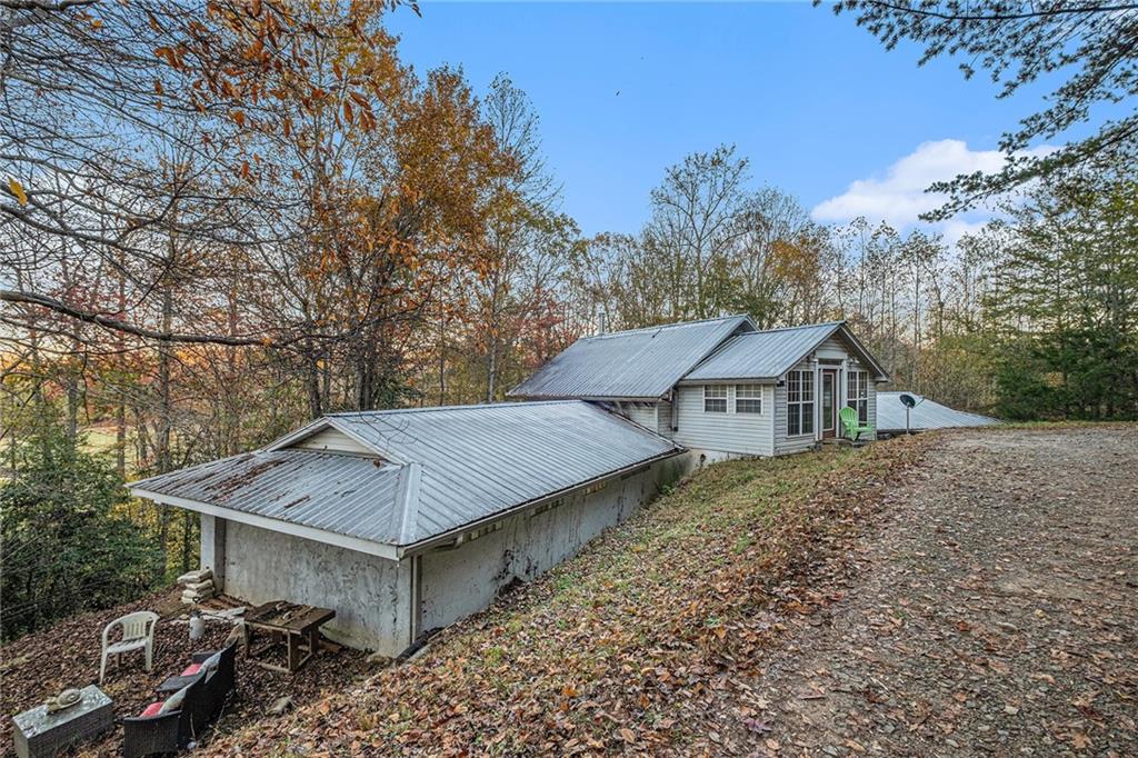 880 Golf Course Road Demorest, GA 30535 - Photo 36 of 37 a view of house with trees in the background