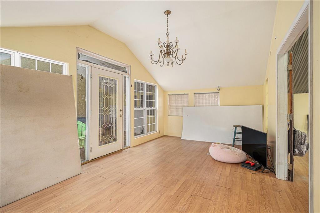 880 Golf Course Road Demorest, GA 30535 - Photo 5 of 37 a view of a livingroom with furniture wooden floor and windows