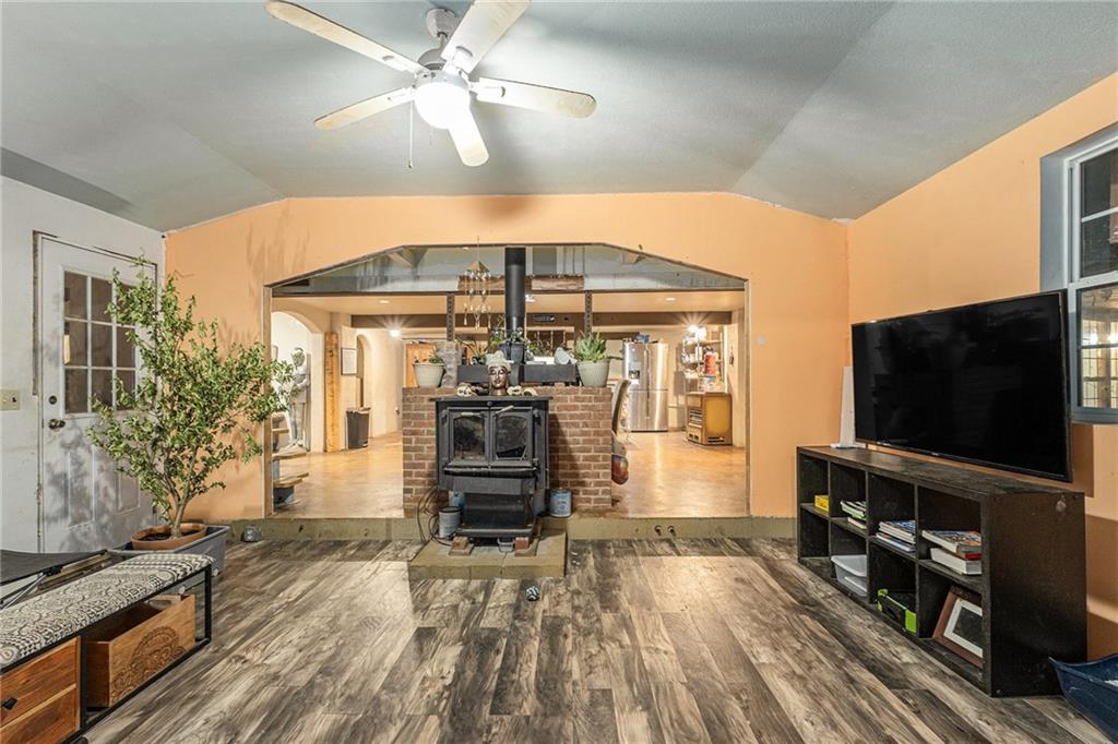 880 Golf Course Road Demorest, GA 30535 - Photo 9 of 37 a living room with furniture and a flat screen tv