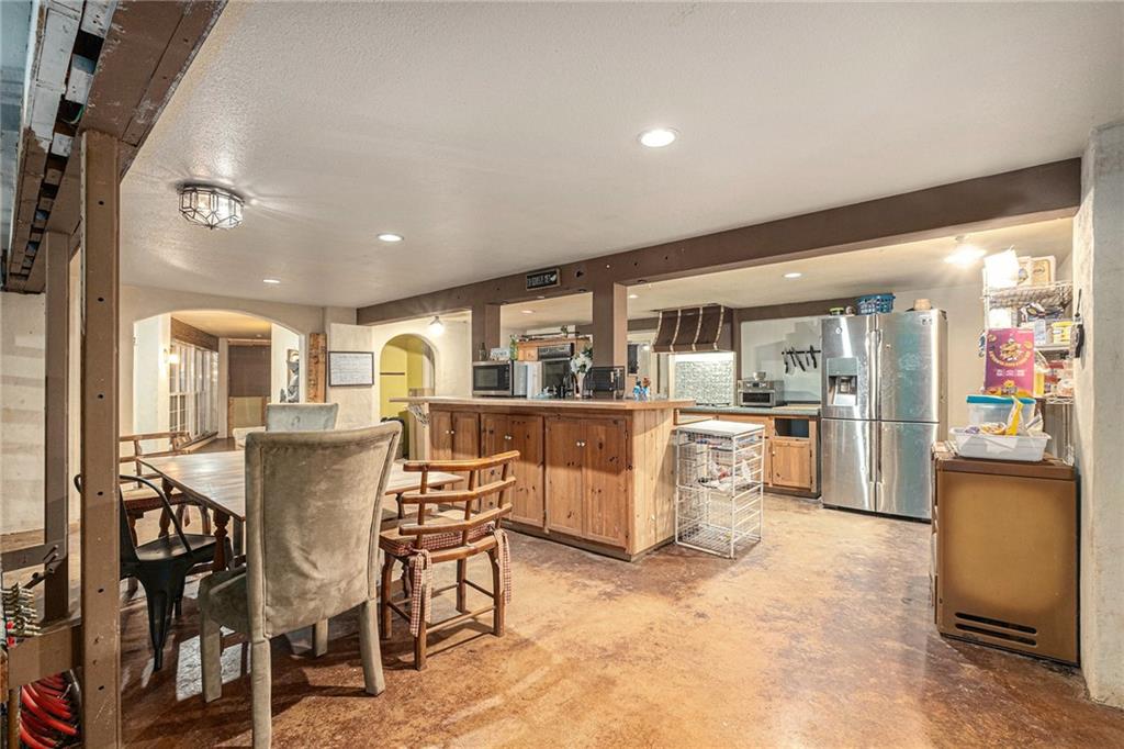 880 Golf Course Road Demorest, GA 30535 - Photo 10 of 37 a dining area with furniture and a kitchen view