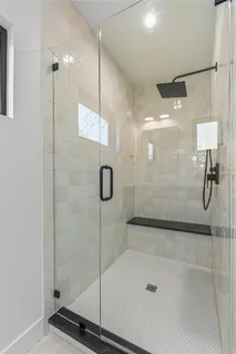 a bathroom with a granite countertop sink two mirror and a