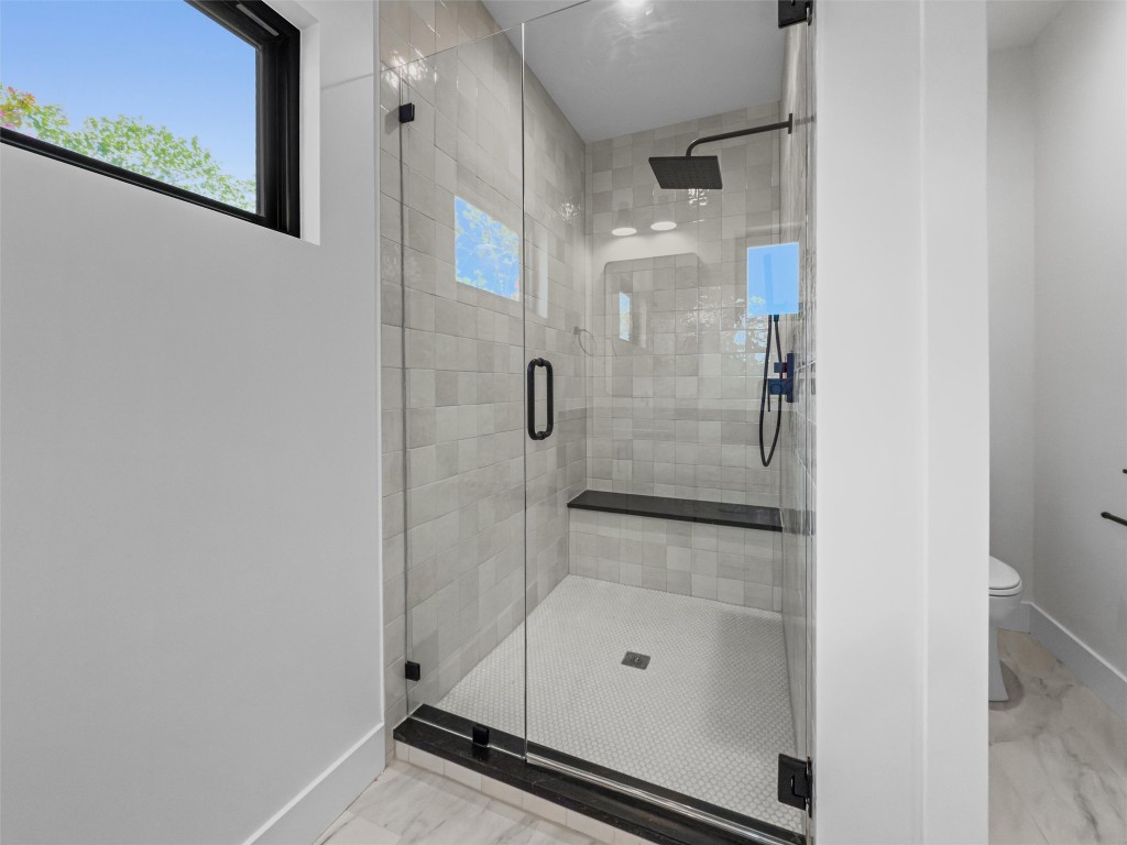 1402 Beckett Street, Unit 1B Austin, TX 78757 - Photo 17 of 32 a bathroom with a shower
