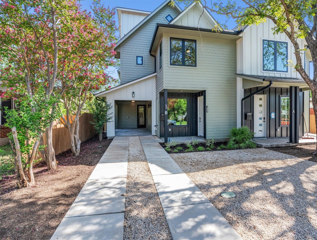 1402 Beckett Street, Unit 1B Austin, TX 78757 - Photo 2 of 32 a front view of a house with a yard and garage