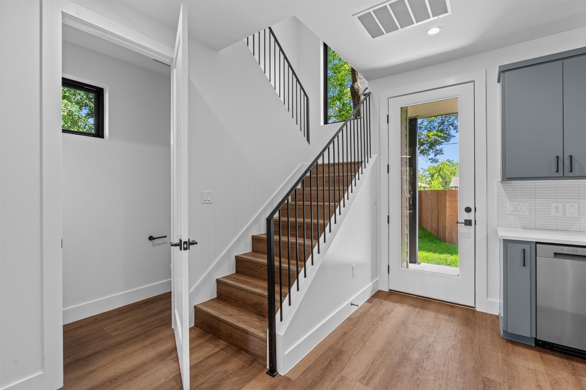 1402 Beckett Street, Unit 1B Austin, TX 78757 - Photo 7 of 32 a view of entryway with wooden floor and stairs