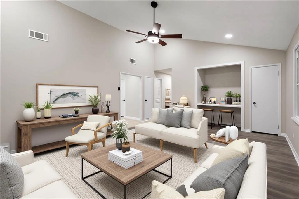 a living room with furniture and a table