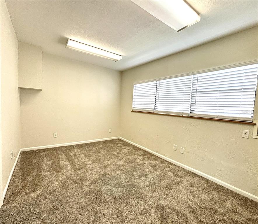 2350 26th Street North St. Petersburg, FL 33713 - Photo 12 of 18 an empty room with a workbench