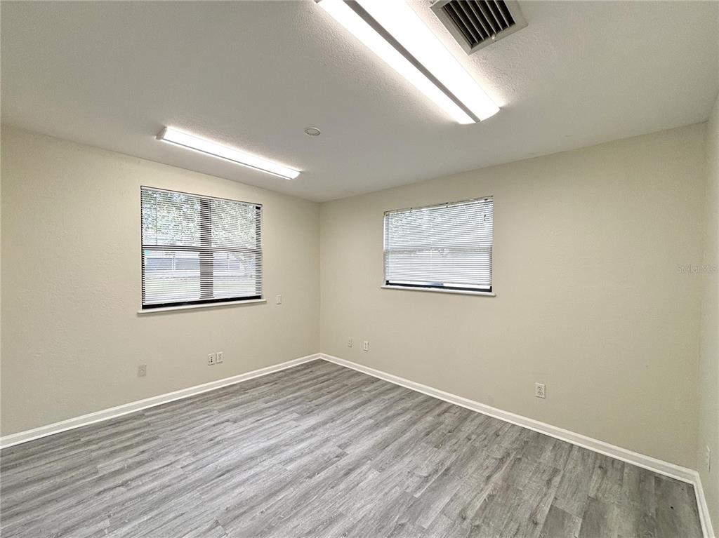 2350 26th Street North St. Petersburg, FL 33713 - Photo 16 of 18 wooden floor in an empty room with a window