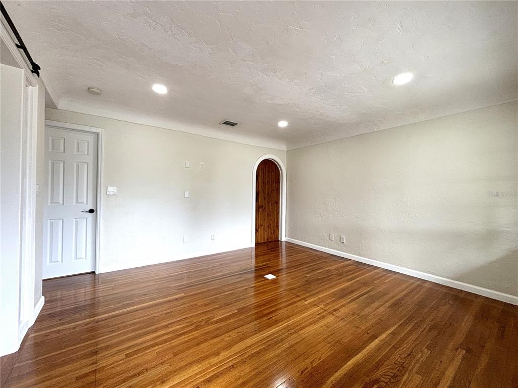 2350 26th Street North St. Petersburg, FL 33713 - Photo 4 of 18 a view of a room with wooden floor and a window