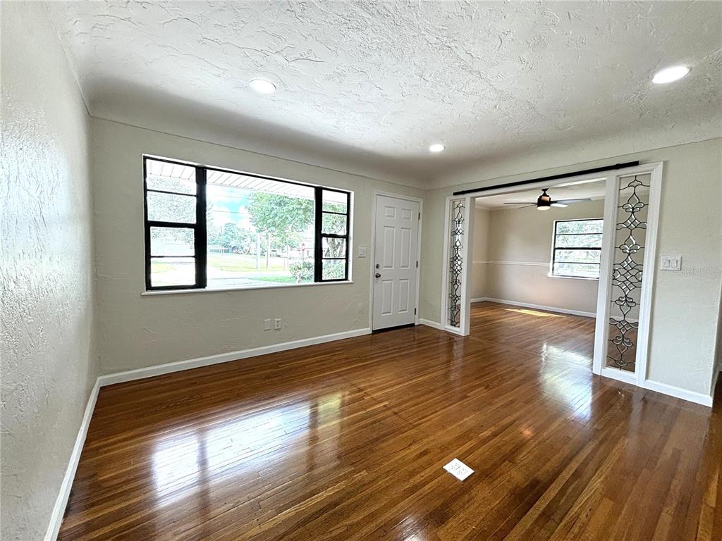 2350 26th Street North St. Petersburg, FL 33713 - Photo 6 of 18 a view of empty room with wooden floor and fan