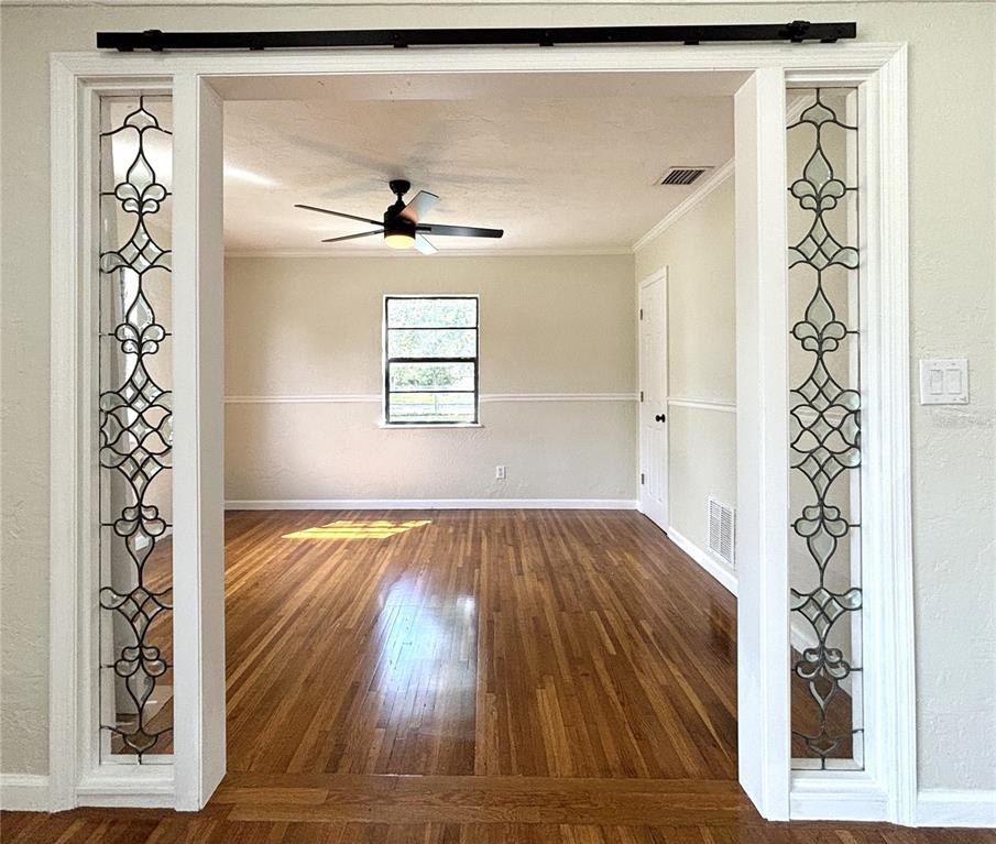 2350 26th Street North St. Petersburg, FL 33713 - Photo 7 of 18 wooden floor in an empty room with a window