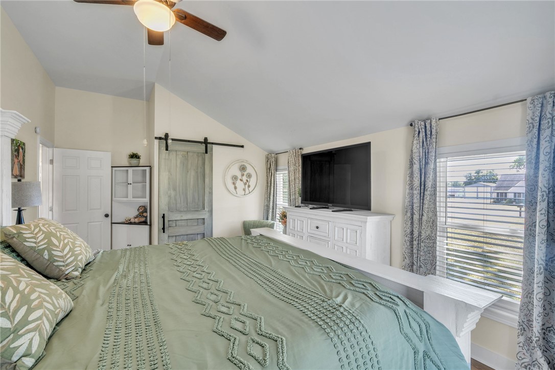 1048 Old Gantt Mill Road Anderson, SC 29625 - Photo 13 of 30 Angled ceilings and multiple windows frame this serene bedroom space.