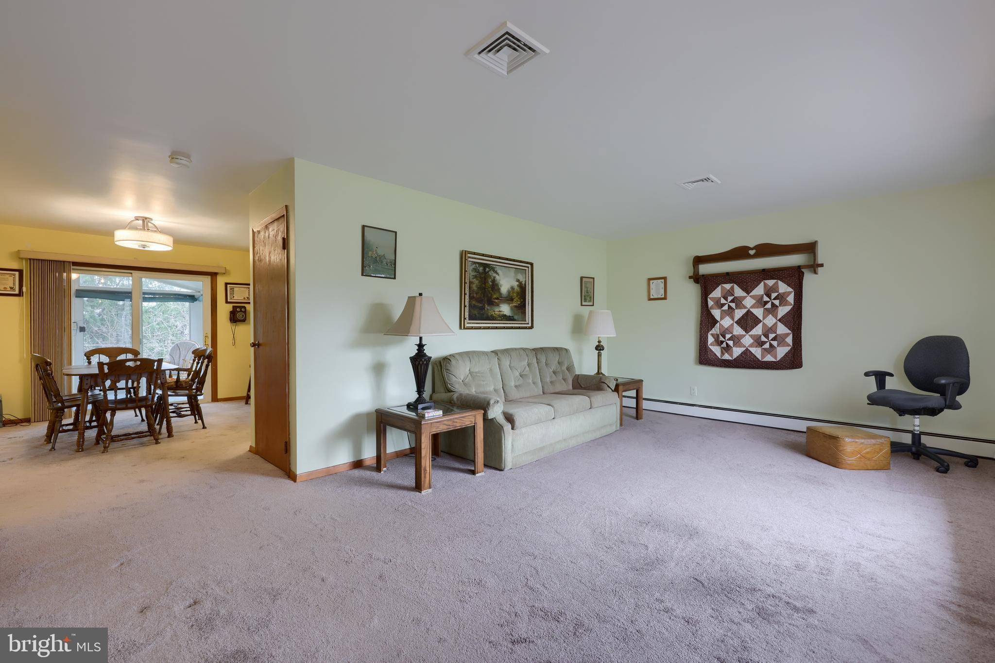 3916 Grant Street Reading, PA 19606 - Photo 15 of 39 a view of game room with window and couch