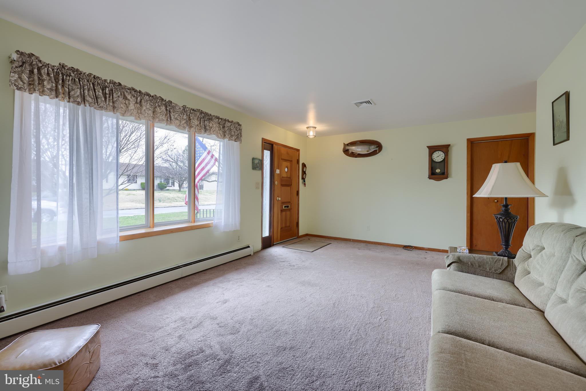 3916 Grant Street Reading, PA 19606 - Photo 16 of 39 a living room with furniture and a window