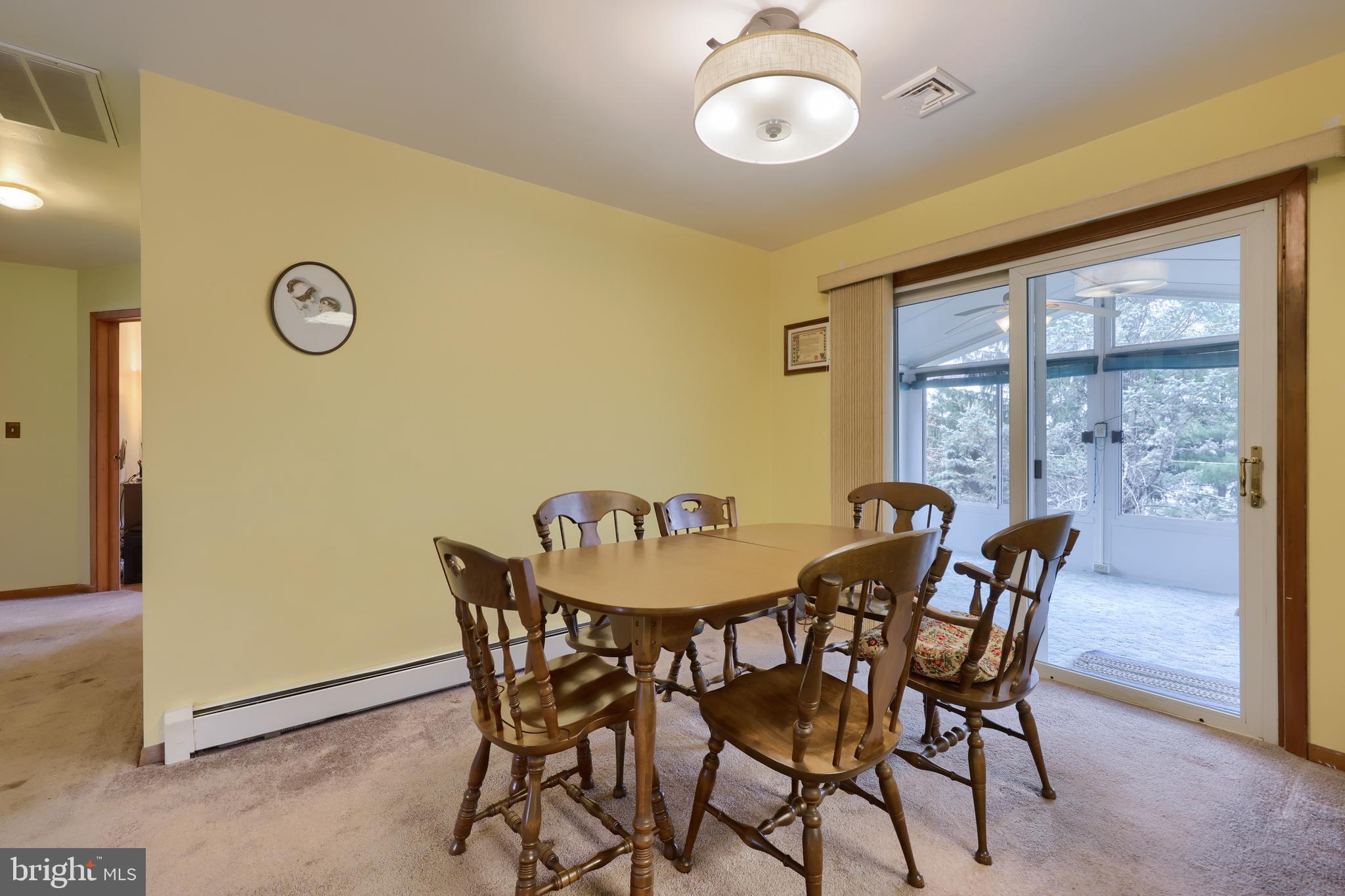 3916 Grant Street Reading, PA 19606 - Photo 17 of 39 a view of a dining room with furniture and a window