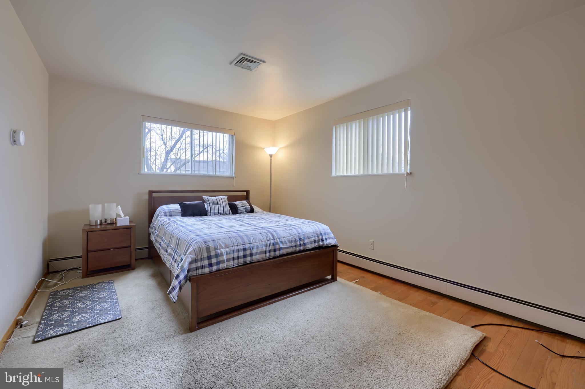 3916 Grant Street Reading, PA 19606 - Photo 28 of 39 a bedroom with a bed wall painting and a window