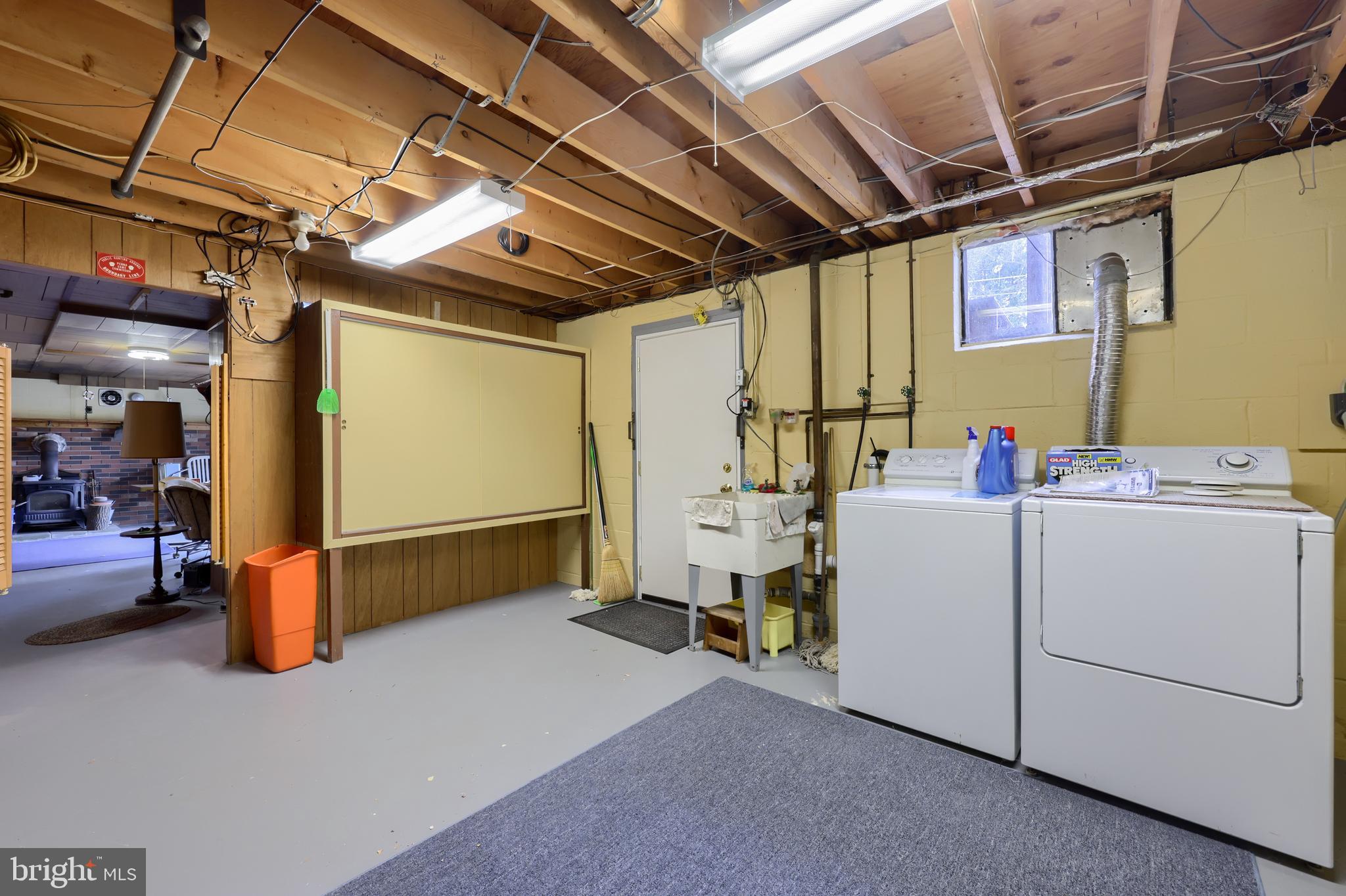 3916 Grant Street Reading, PA 19606 - Photo 30 of 39 a storage room with dryer and washer