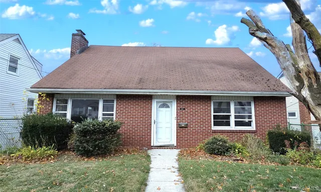 a house view with a garden space
