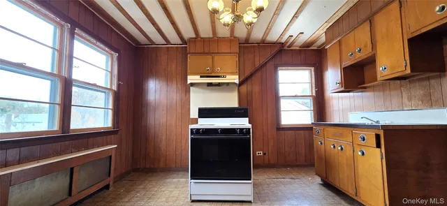 a kitchen with stainless steel appliances granite countertop a stove and a refrigerator