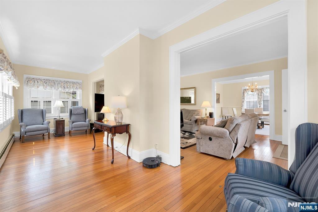 106 Maple Street Rutherford, NJ 07070 - Photo 11 of 50 a living room with furniture and a wooden floor