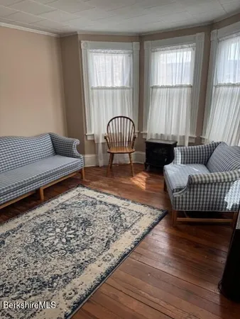 a living room with furniture or couch and a window