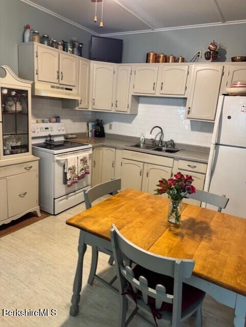 11 Melrose Street Adams, MA 01220 - Photo 9 of 21 a kitchen with stainless steel appliances cabinets a table and chairs in it