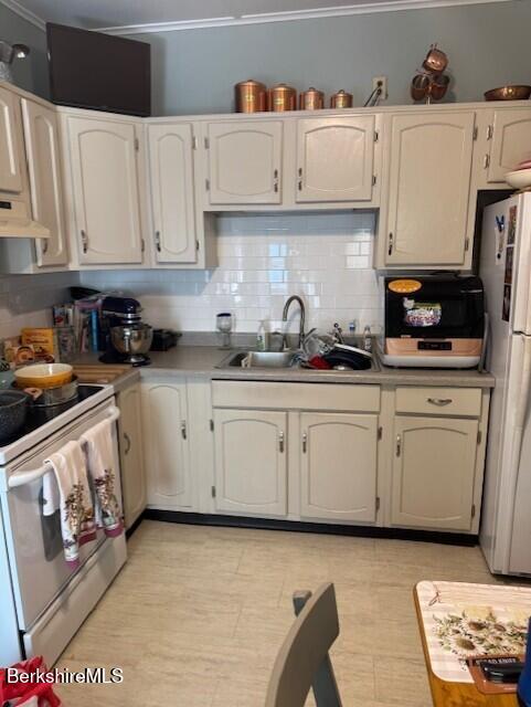 11 Melrose Street Adams, MA 01220 - Photo 10 of 21 a kitchen with white cabinets and white appliances