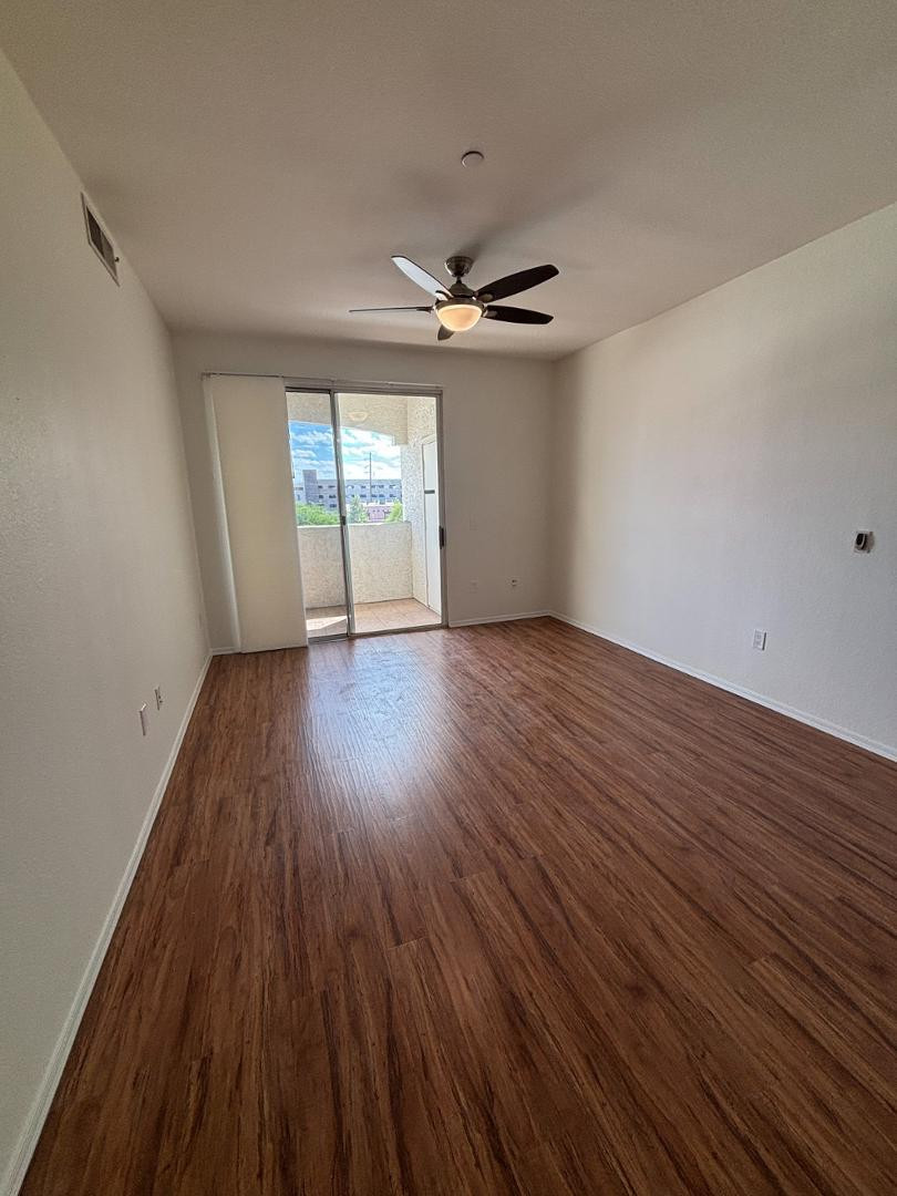 3302 North 7th Street, Unit 335 Phoenix, AZ 85014 - Photo 4 of 14 wooden floor in an empty room with a window