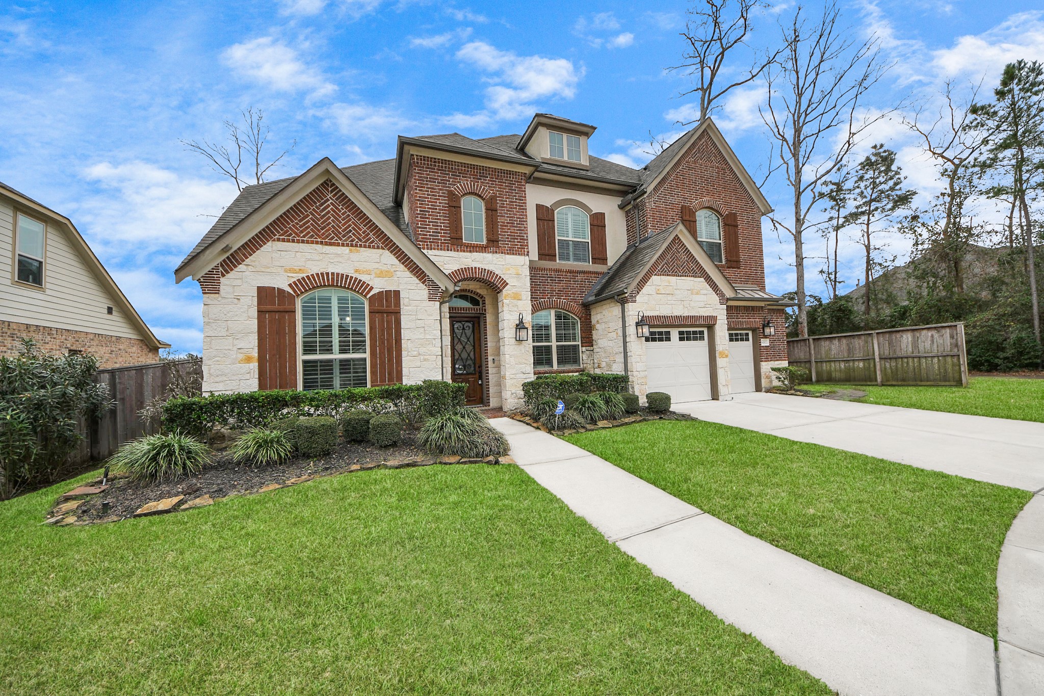6002 Granite Shadow Lane Houston, TX 77365 - Photo 2 of 49 a front view of a house with a yard