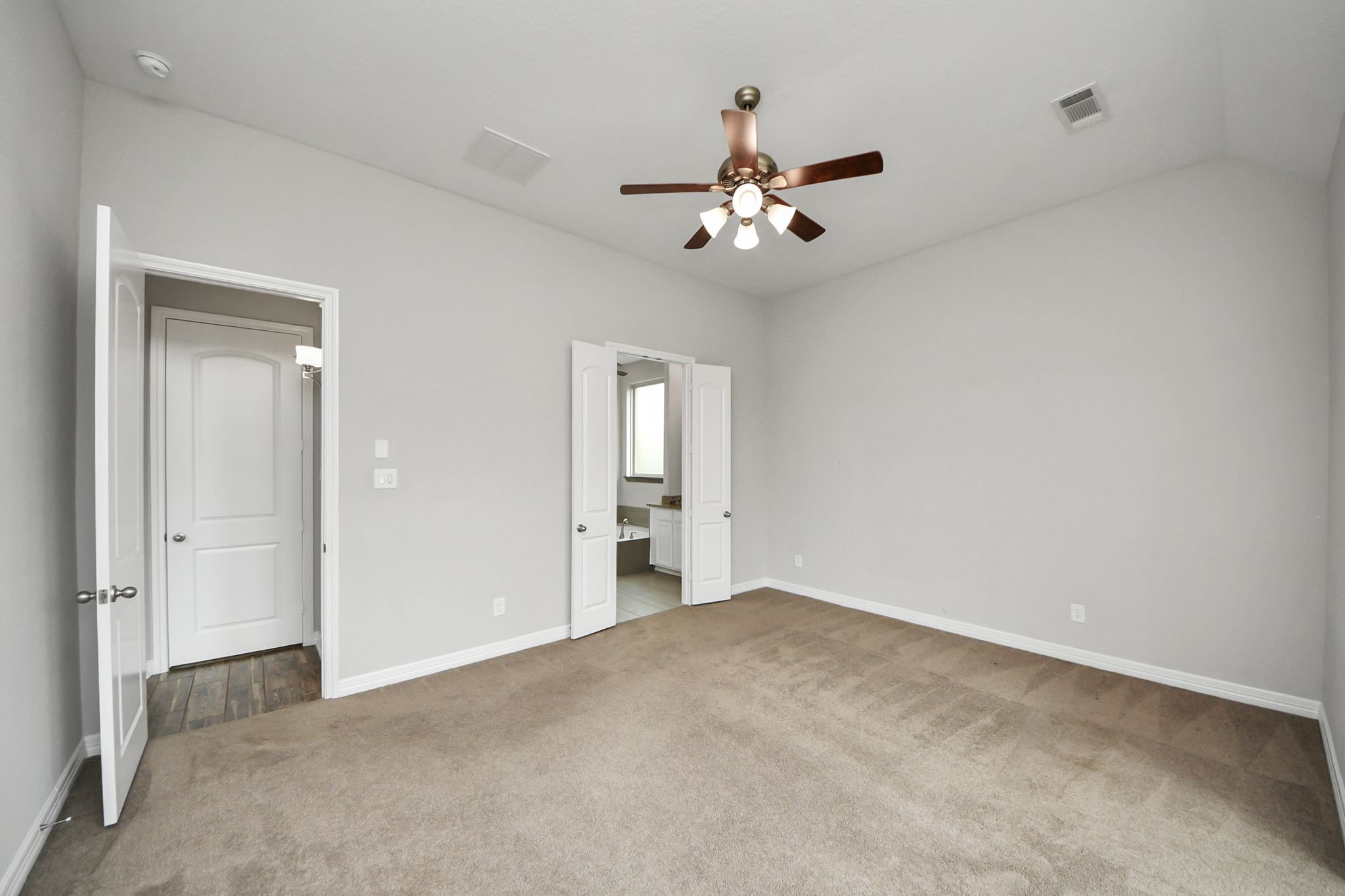 6002 Granite Shadow Lane Houston, TX 77365 - Photo 43 of 49 a view of an empty room with a fan