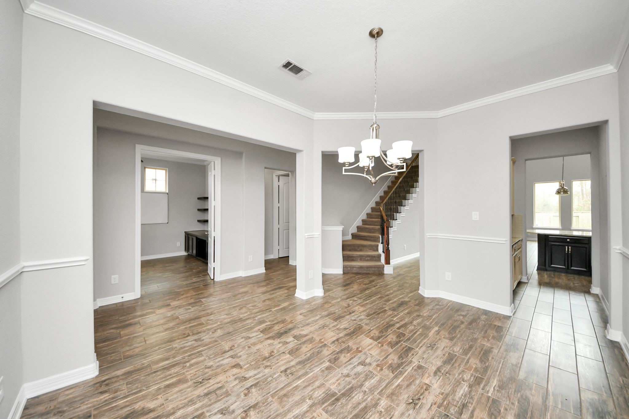 6002 Granite Shadow Lane Houston, TX 77365 - Photo 5 of 49 a view of a livingroom with wooden floor and stairs