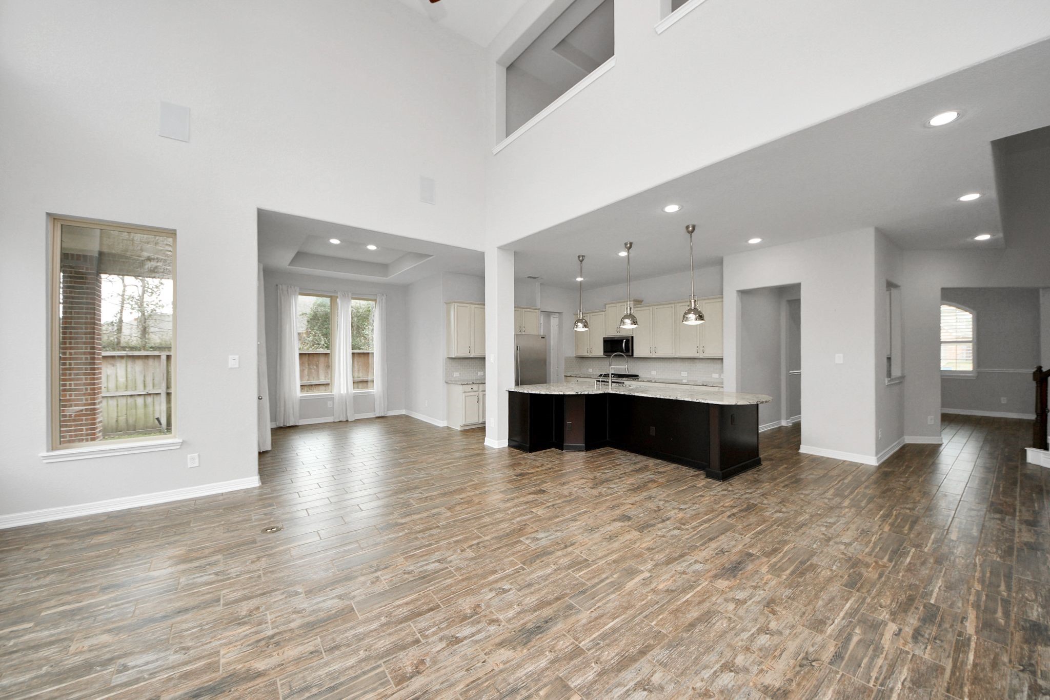 6002 Granite Shadow Lane Houston, TX 77365 - Photo 8 of 49 a view of kitchen with kitchen island sink and refrigerator