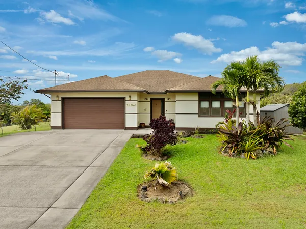 a front view of a house with a yard