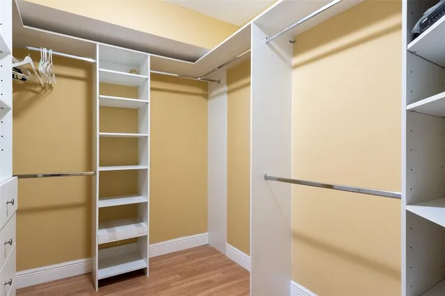 a view of an empty walk in closet