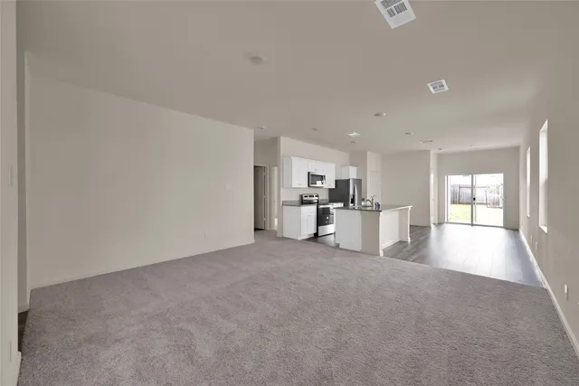 a kitchen with stainless steel appliances granite countertop a sink and a granite counter tops