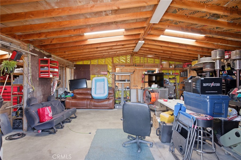 40100 Owl Valley Road Temecula, CA 92592 - Photo 39 of 44 a living room with lots of furniture and clutter