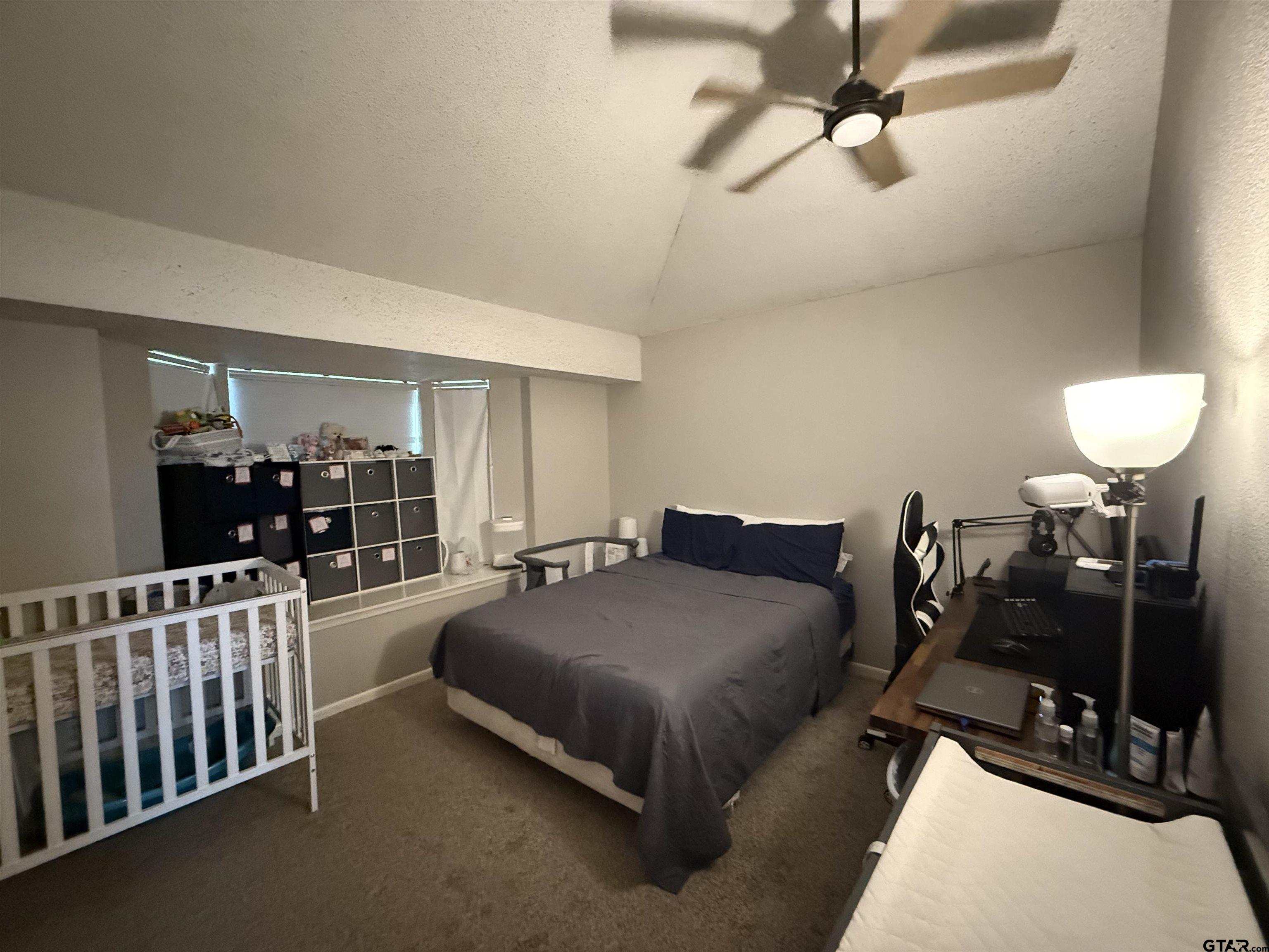 1740 Mill Creek Drive Tyler, TX 75703 - Photo 11 of 19 a bedroom with furniture and a wooden floor
