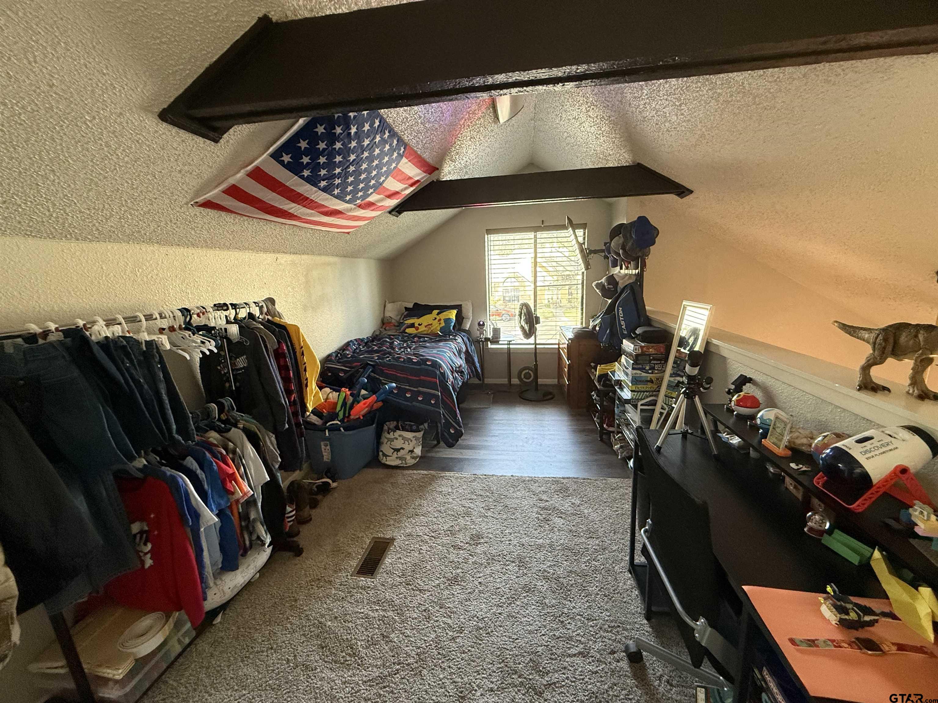 1740 Mill Creek Drive Tyler, TX 75703 - Photo 16 of 19 a view of a living room and a car