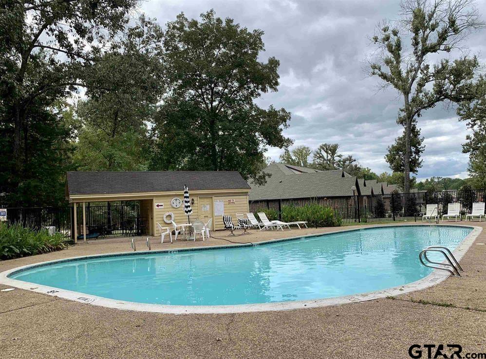 1740 Mill Creek Drive Tyler, TX 75703 - Photo 19 of 19 a view of a house with a yard and sitting area