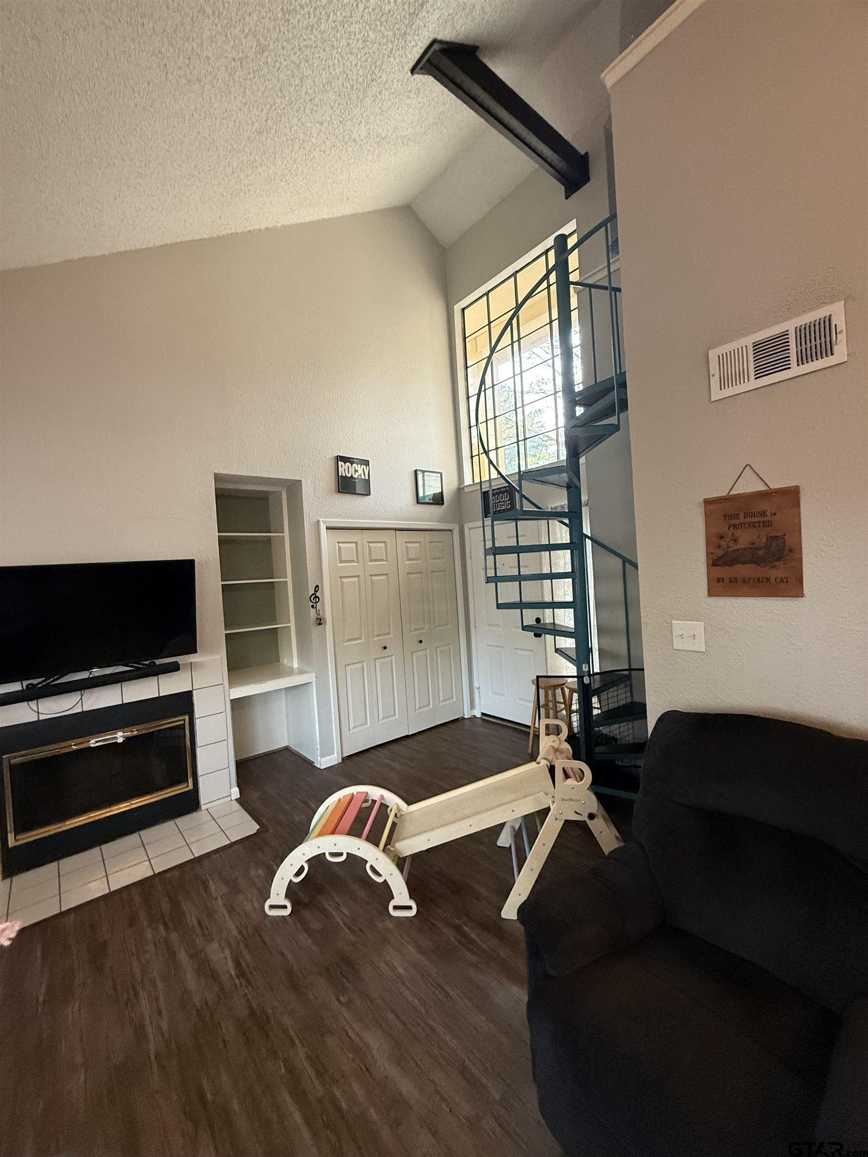 1740 Mill Creek Drive Tyler, TX 75703 - Photo 3 of 19 a living room with furniture and a flat screen tv