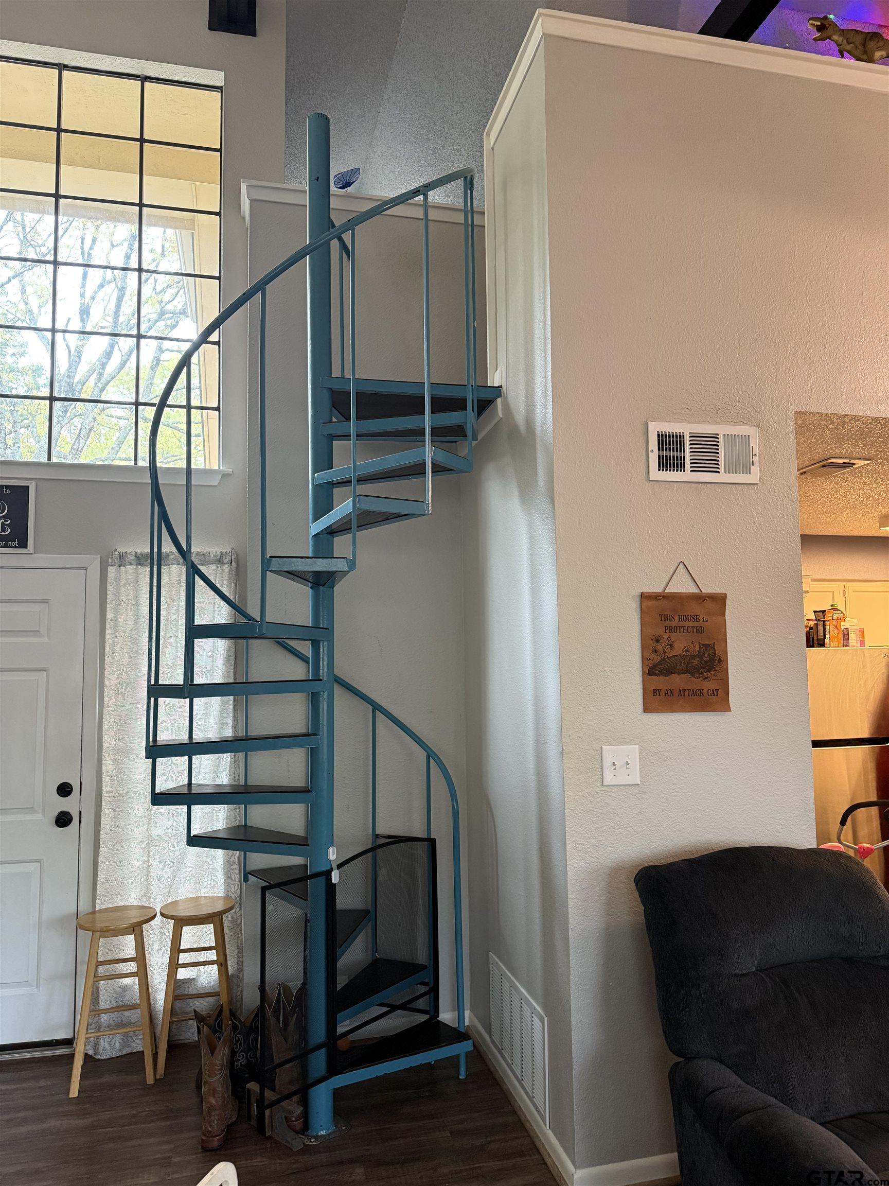 1740 Mill Creek Drive Tyler, TX 75703 - Photo 9 of 19 a view of entryway and hall with wooden floor