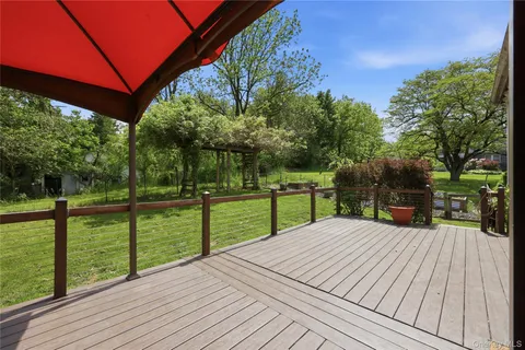 a view of a deck with a yard