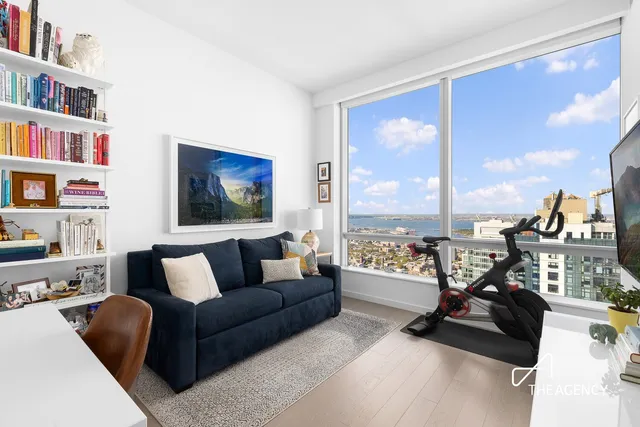 a bathroom with a double vanity sink mirror and shower